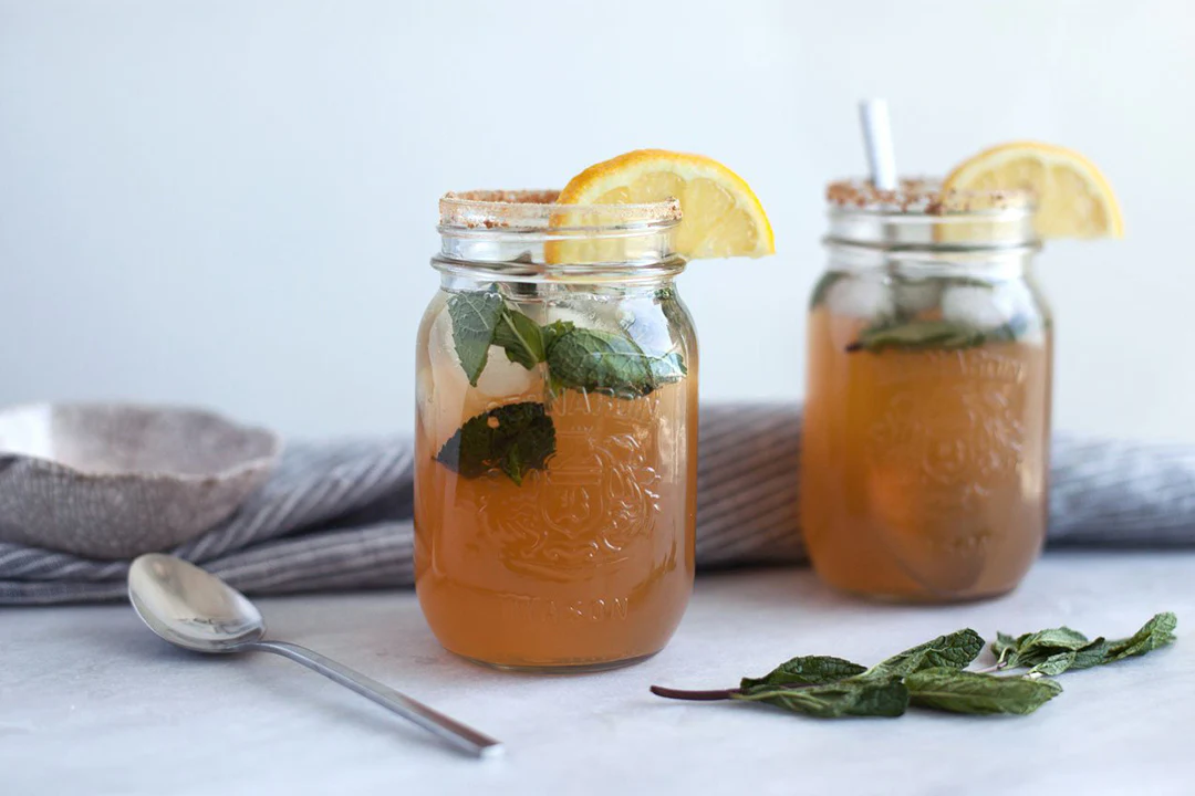 Glass of iced tea with mint and lime